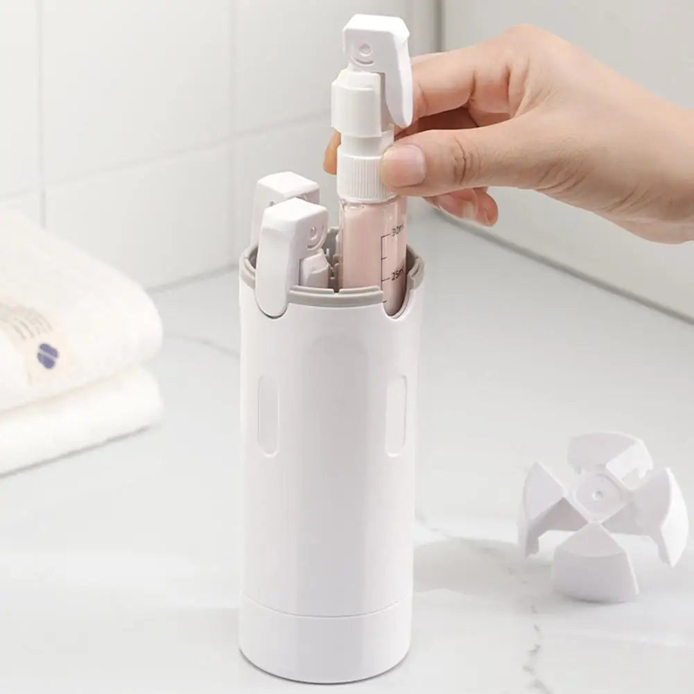 White QuadPod 4-in-1 dispenser on a bathroom counter